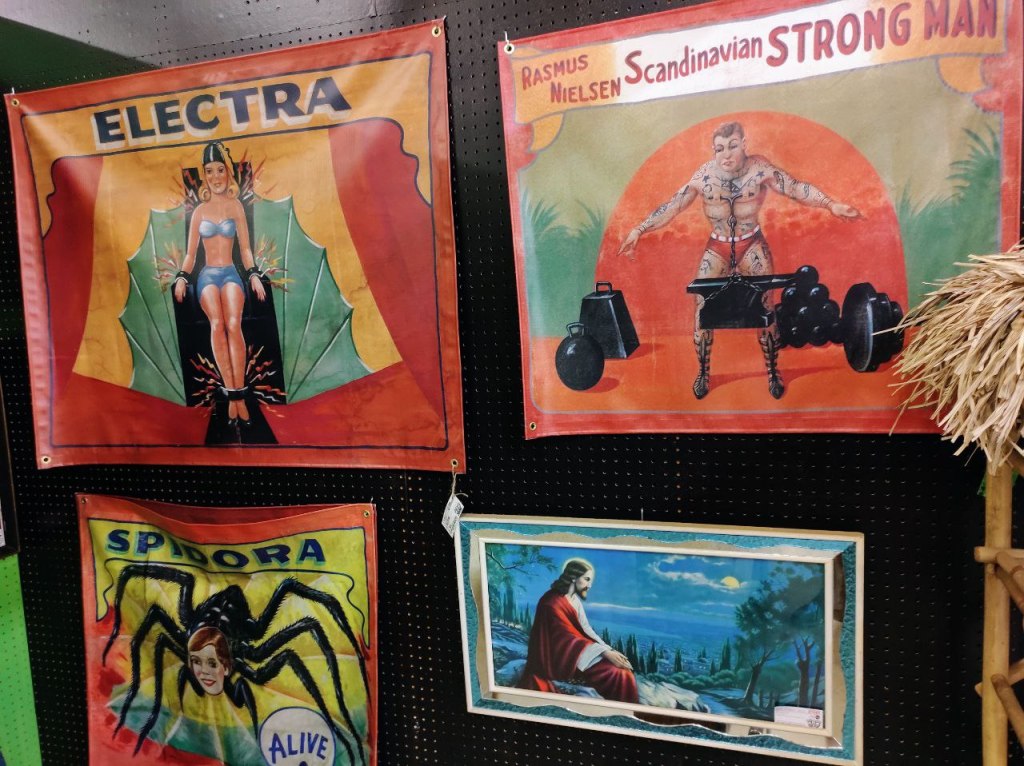 Four panels of circus fantasy art plus one panel of Jesus painting.