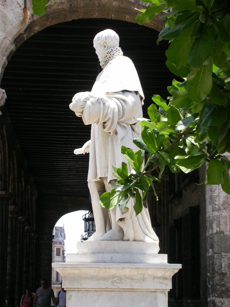 Statue holding a scroll which seen from the side looks like a mega penis.
