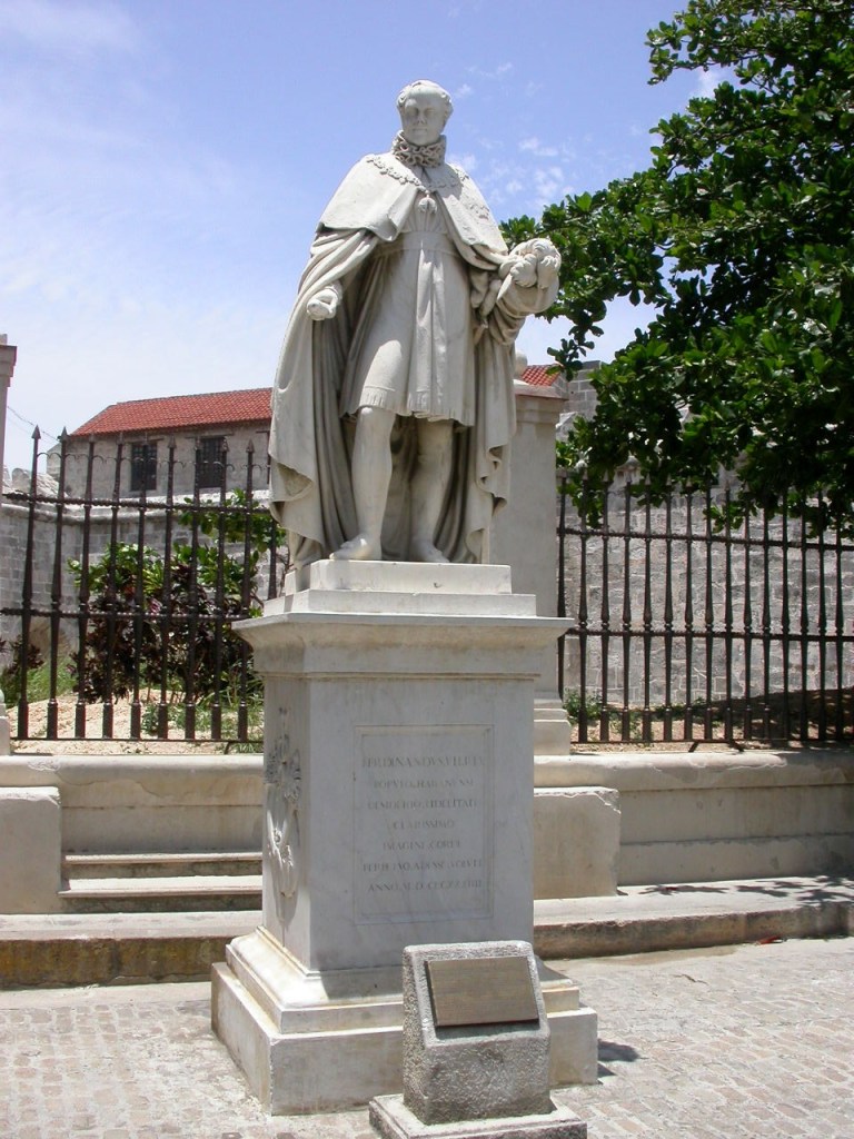 Statue holding a scroll which seen from the side looks like a mega penis.