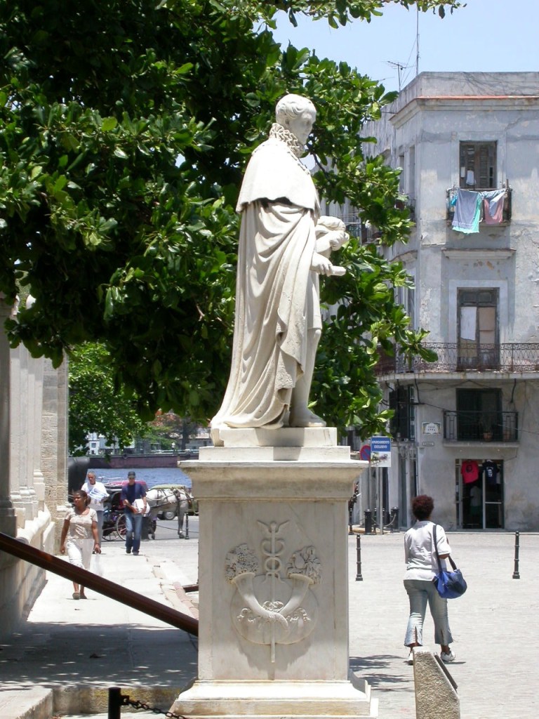 Statue holding a scroll which seen from the side looks like a mega penis.