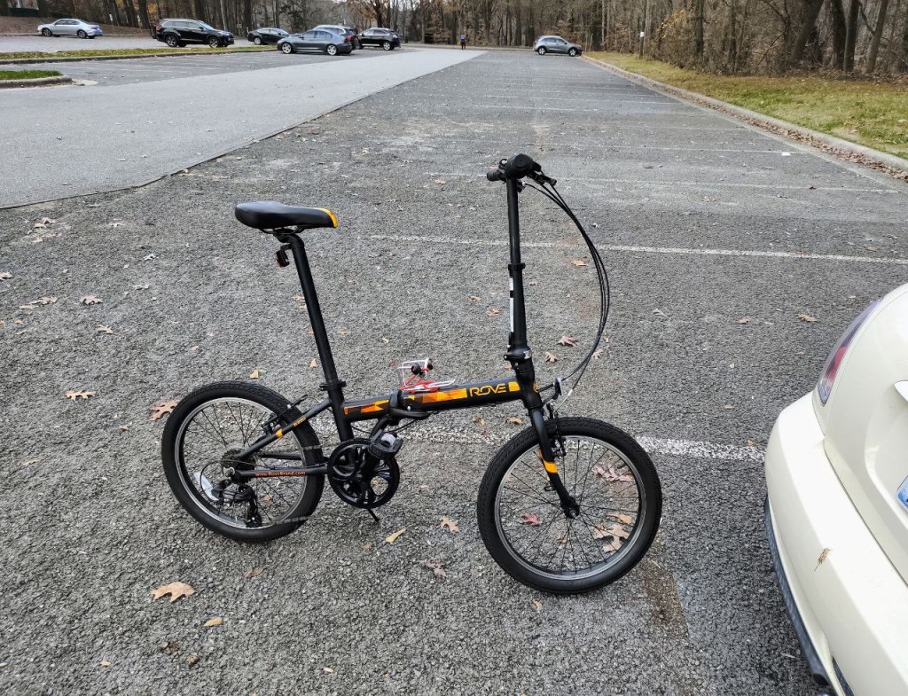 my cute little folding bike outside car