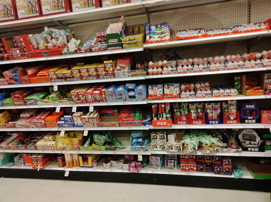 multilevel store shelving packed with selection of other candy