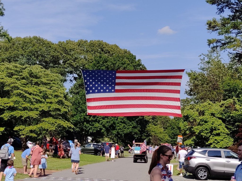 big US flag over parade route